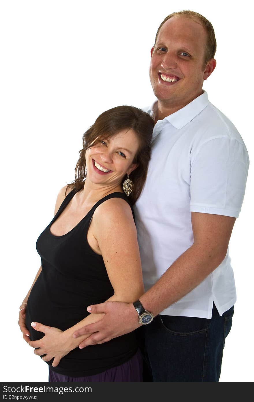 Young couple standing in studio setting isolated over white background. Young couple standing in studio setting isolated over white background.