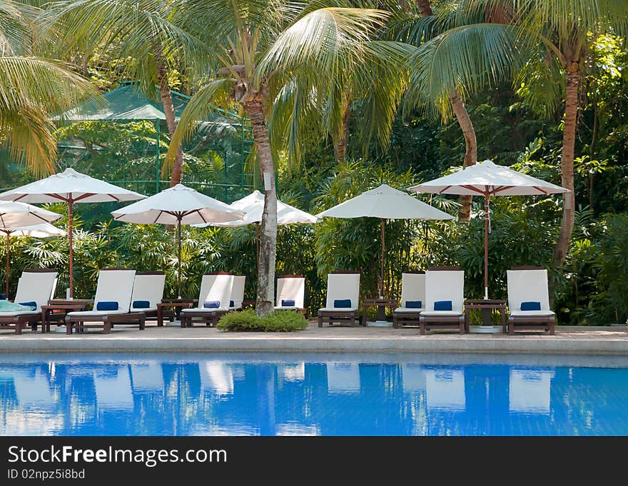 Blue Fresh Swimming Pool with Chair and Table