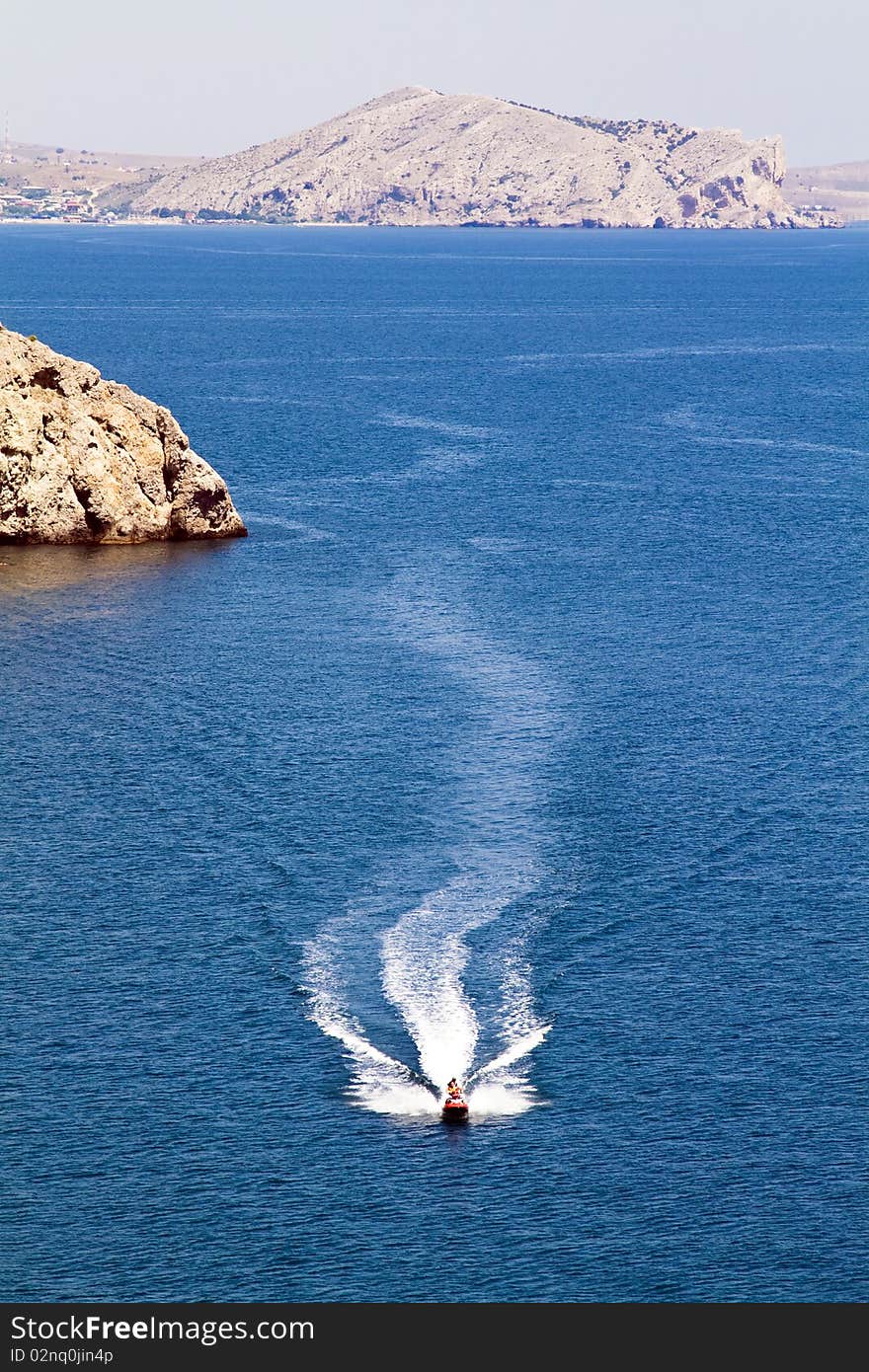 Jetski racing on a blue water background