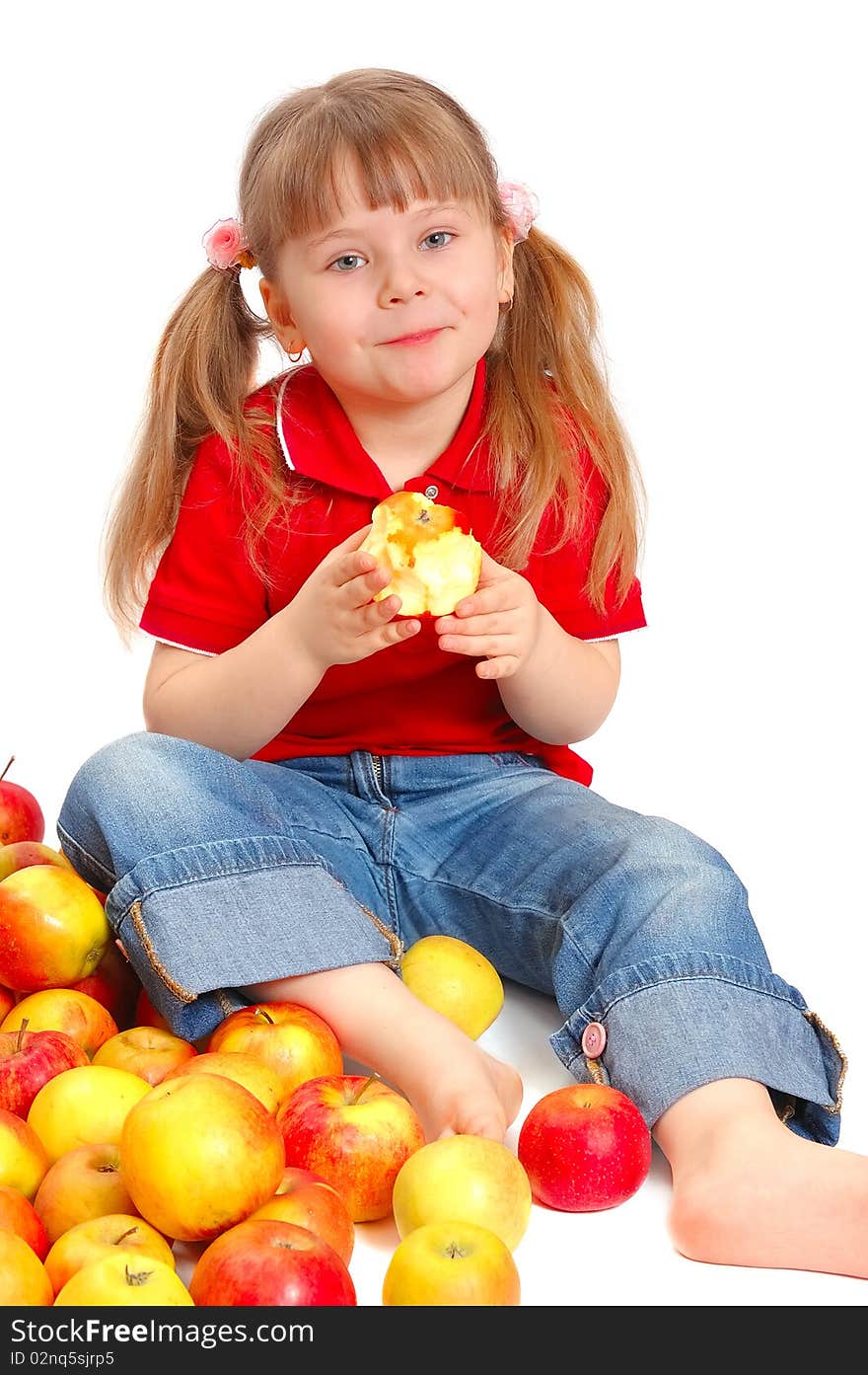 The little girl with apples on white