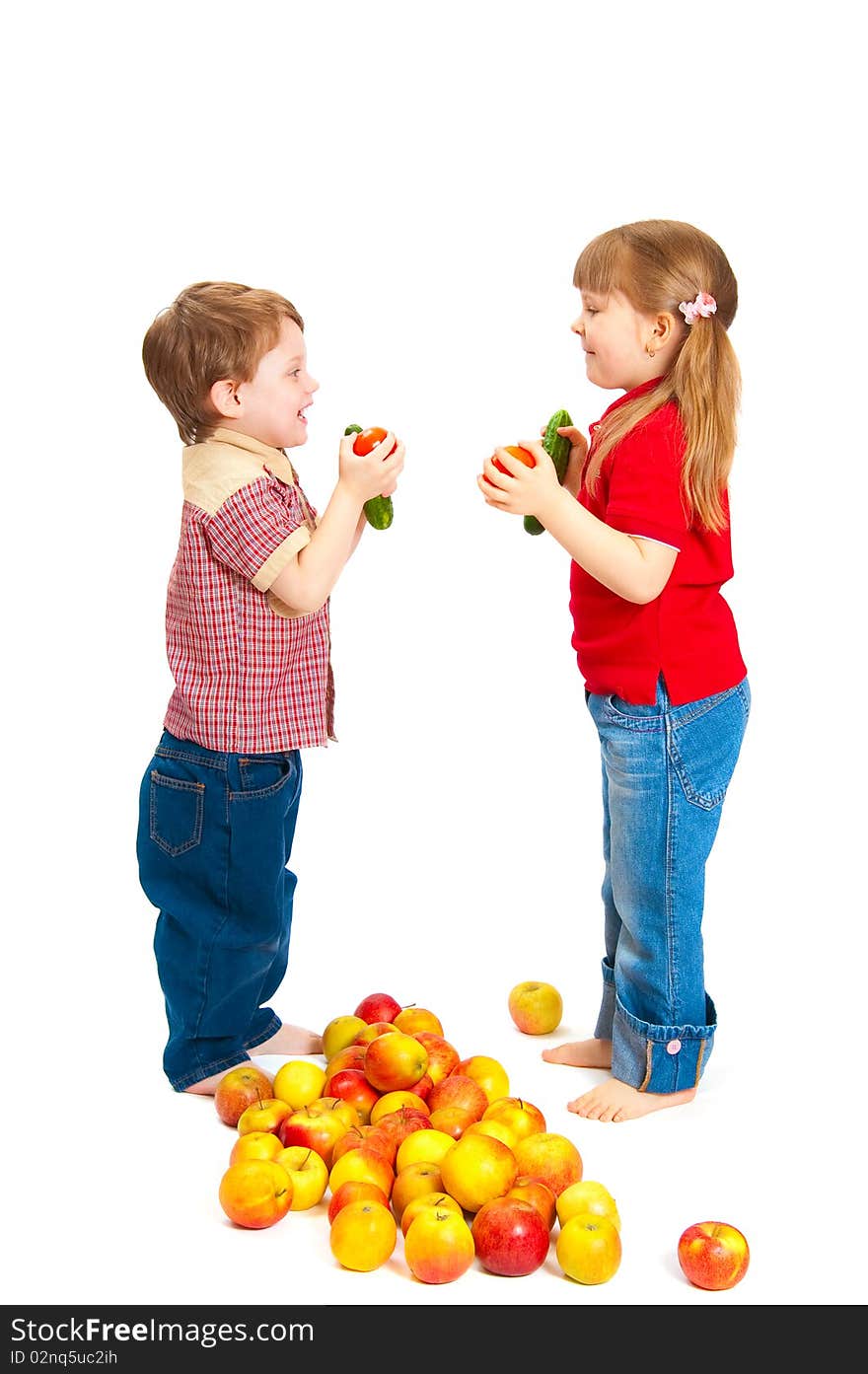 Children with fruit and vegetables isolated on white