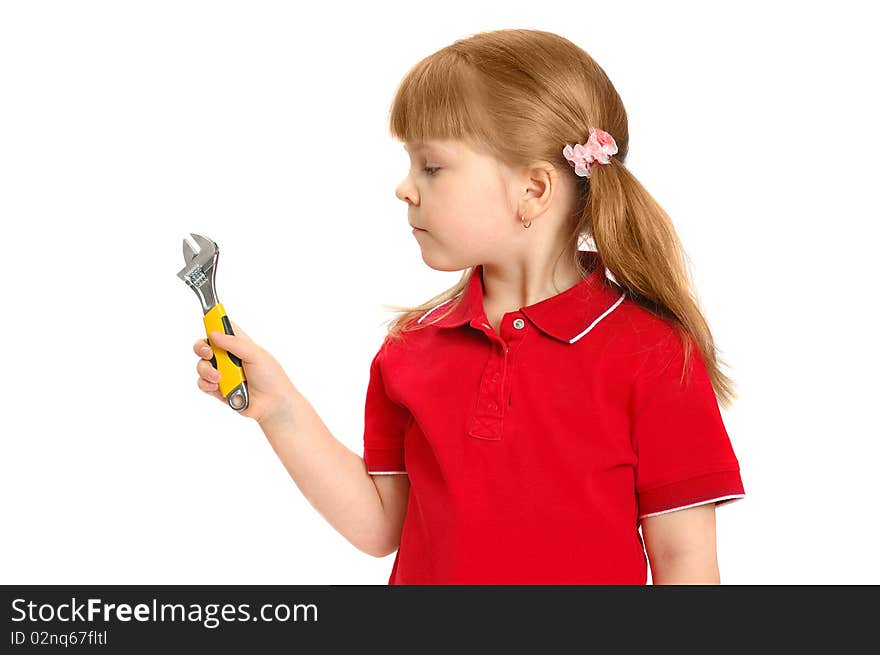 Little girl with a wrench on the white