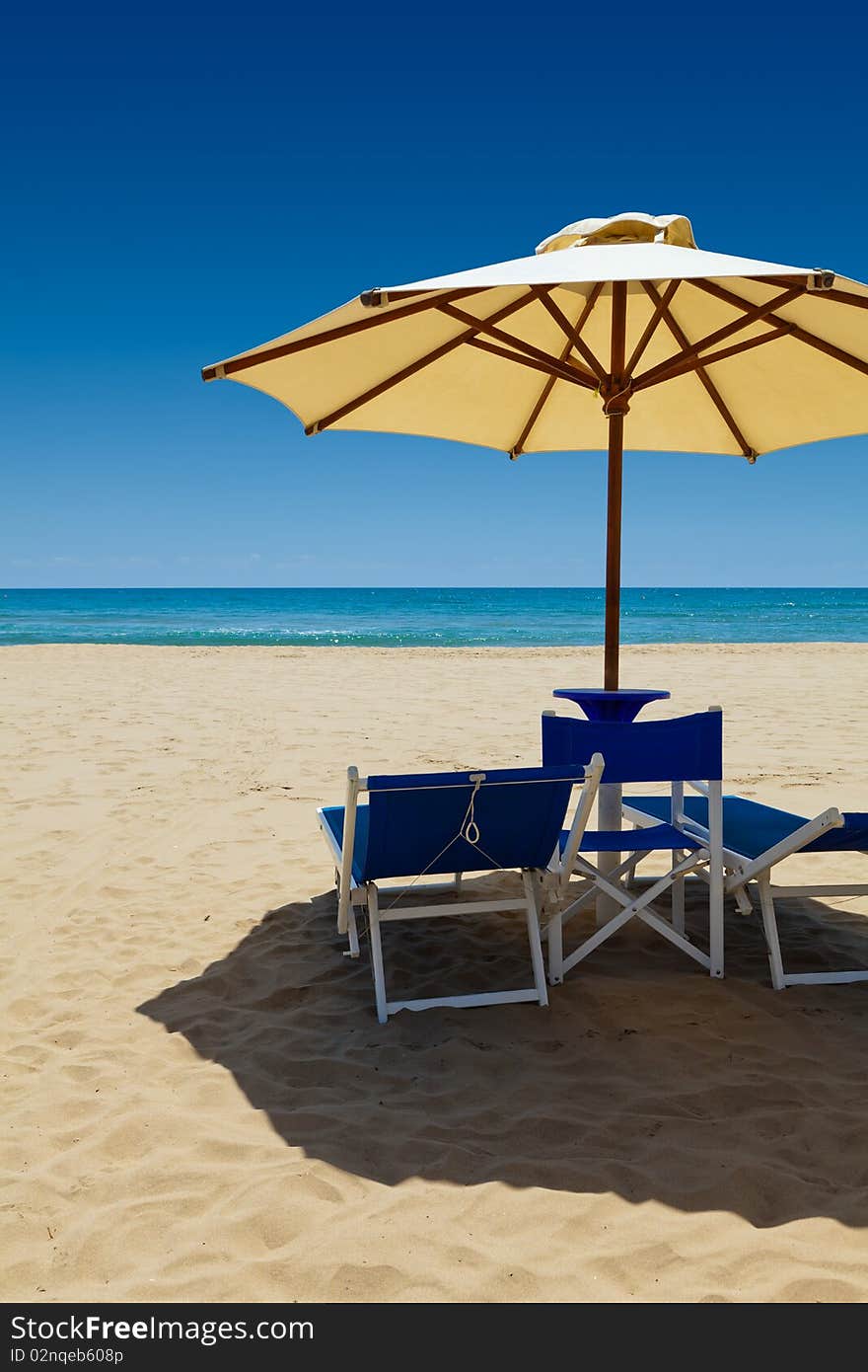 Deck chairs under an umbrella