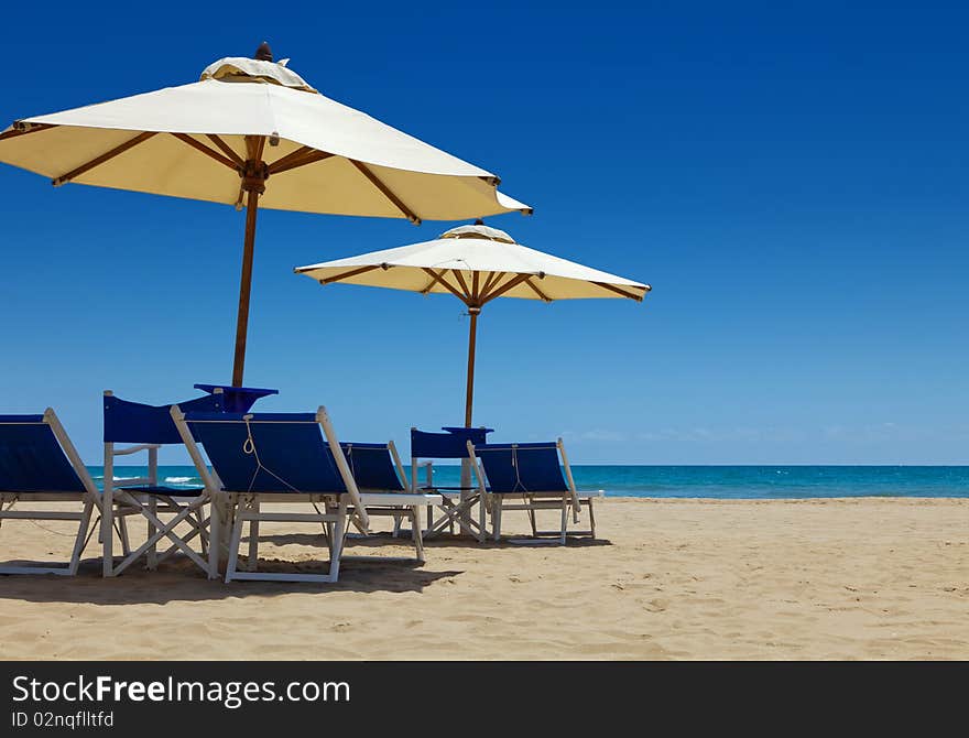 Deck chairs under an umbrella