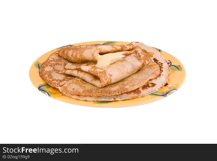 Pancakes with a butter on a white background