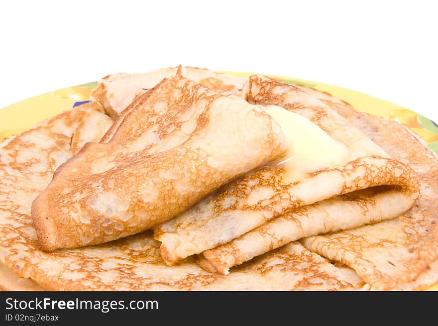 Pancakes with a butter on a white background