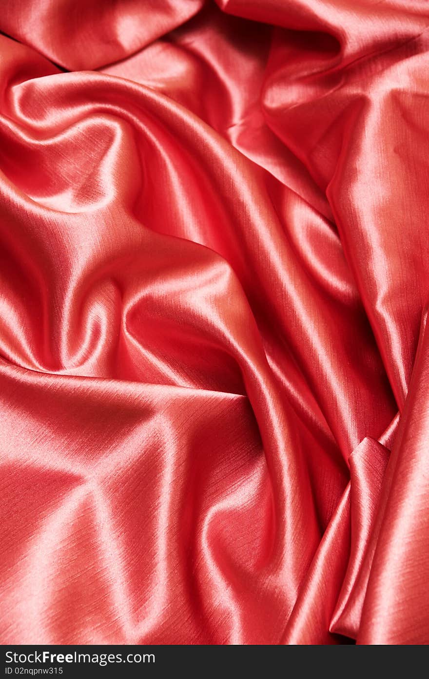 A red satin background or texture