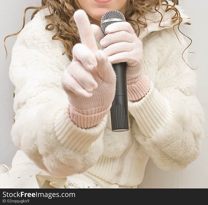 Black microphone in a hand. Black microphone in a hand