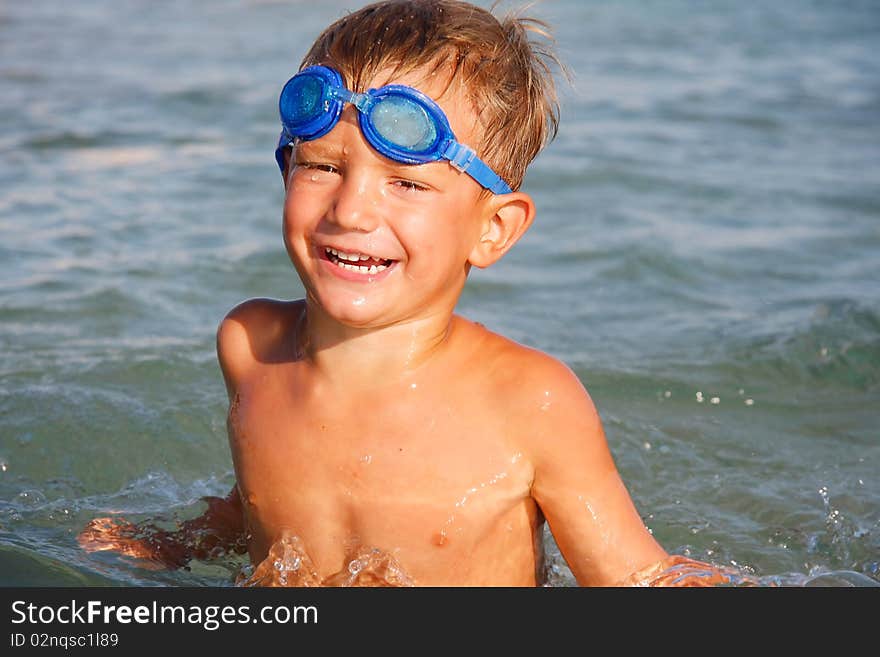 Portrait of happy boy in water