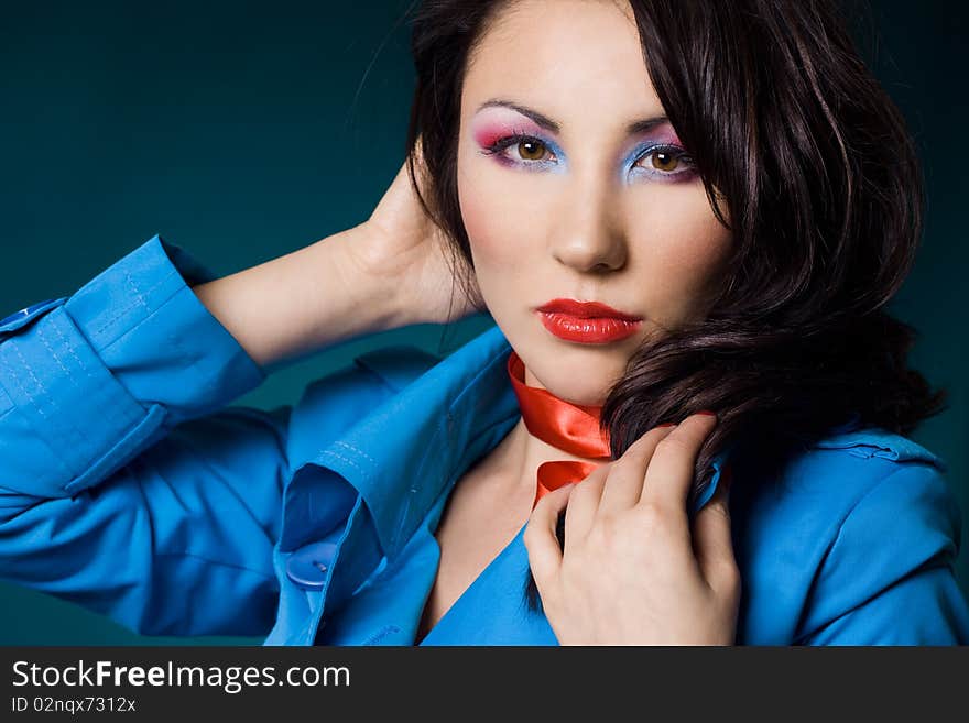 Sexy fashionable woman in blue jacket