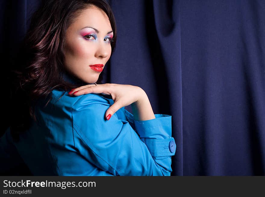 Sexy fashionable woman in blue jacket