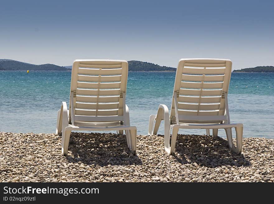 Plastic chairs on the beach