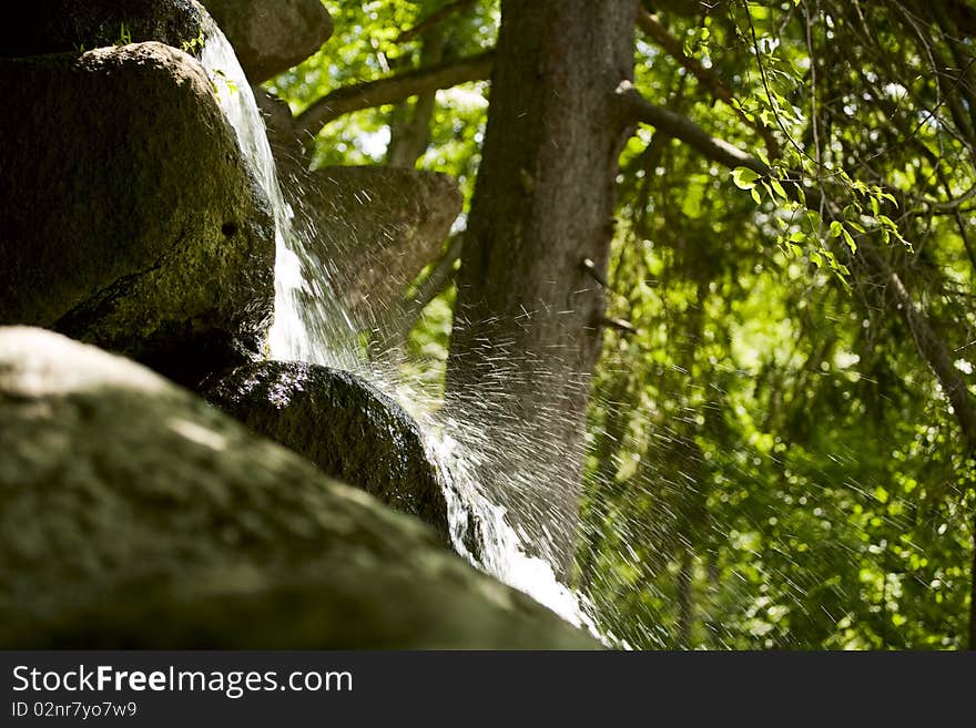 Close up view of the little waterfall in the forest