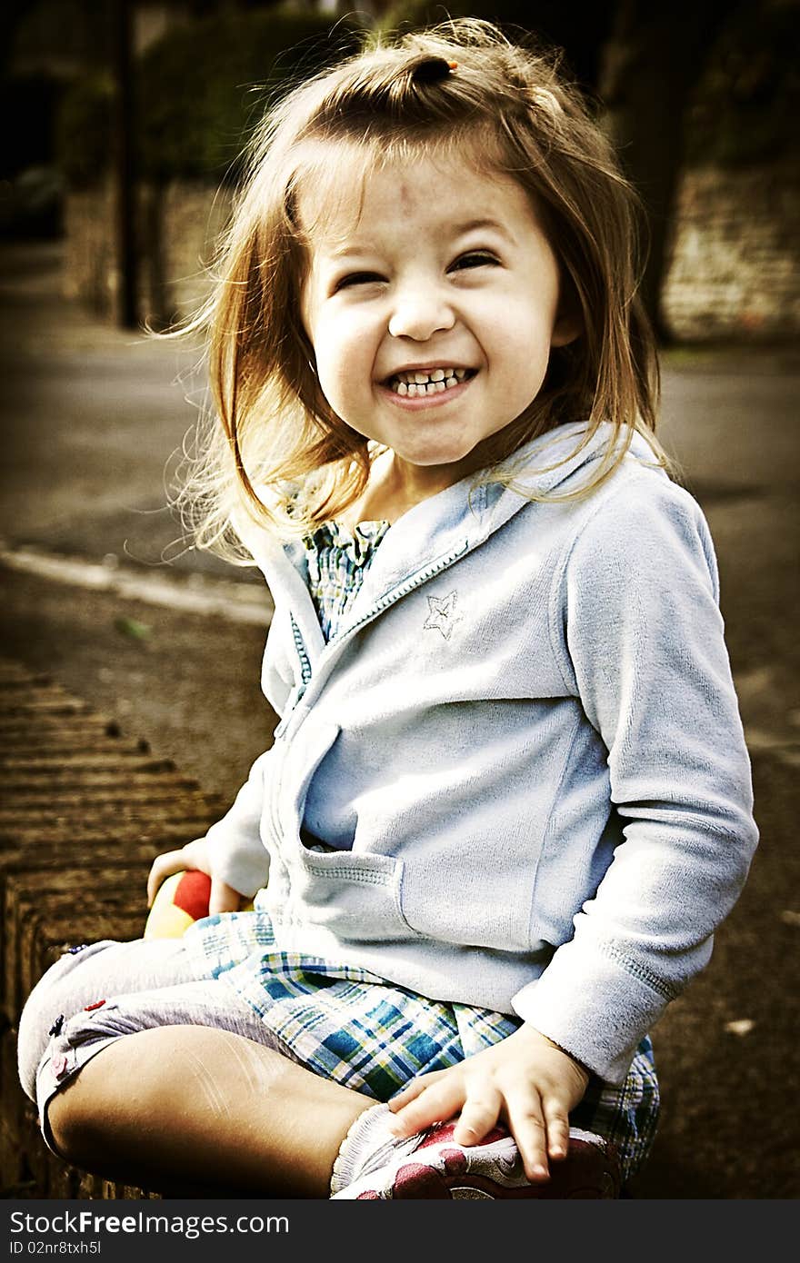 Little cute smiling girl in sepia tone. Little cute smiling girl in sepia tone