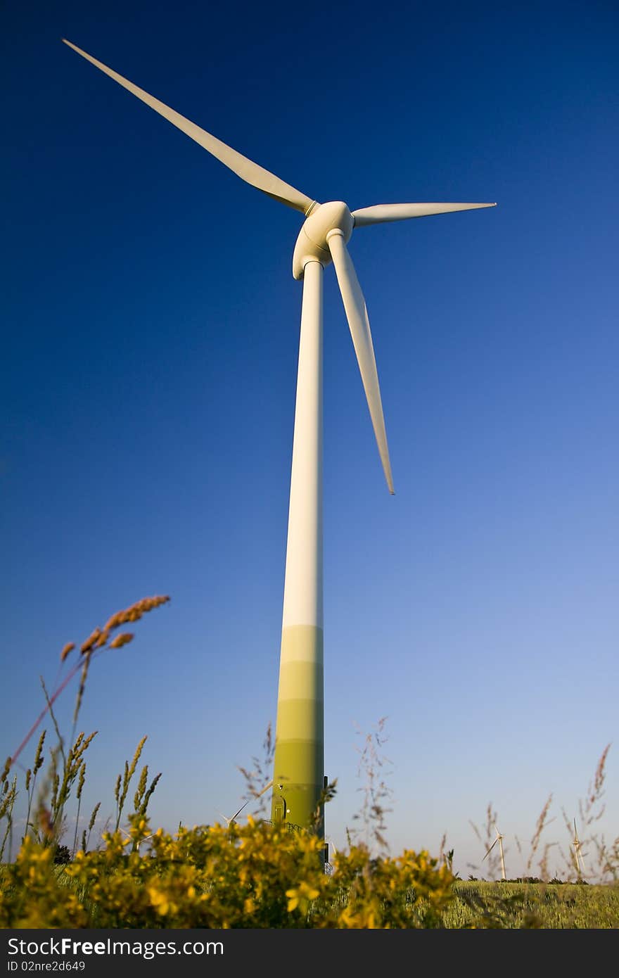 Windmills against a blue sky, alternative energy source