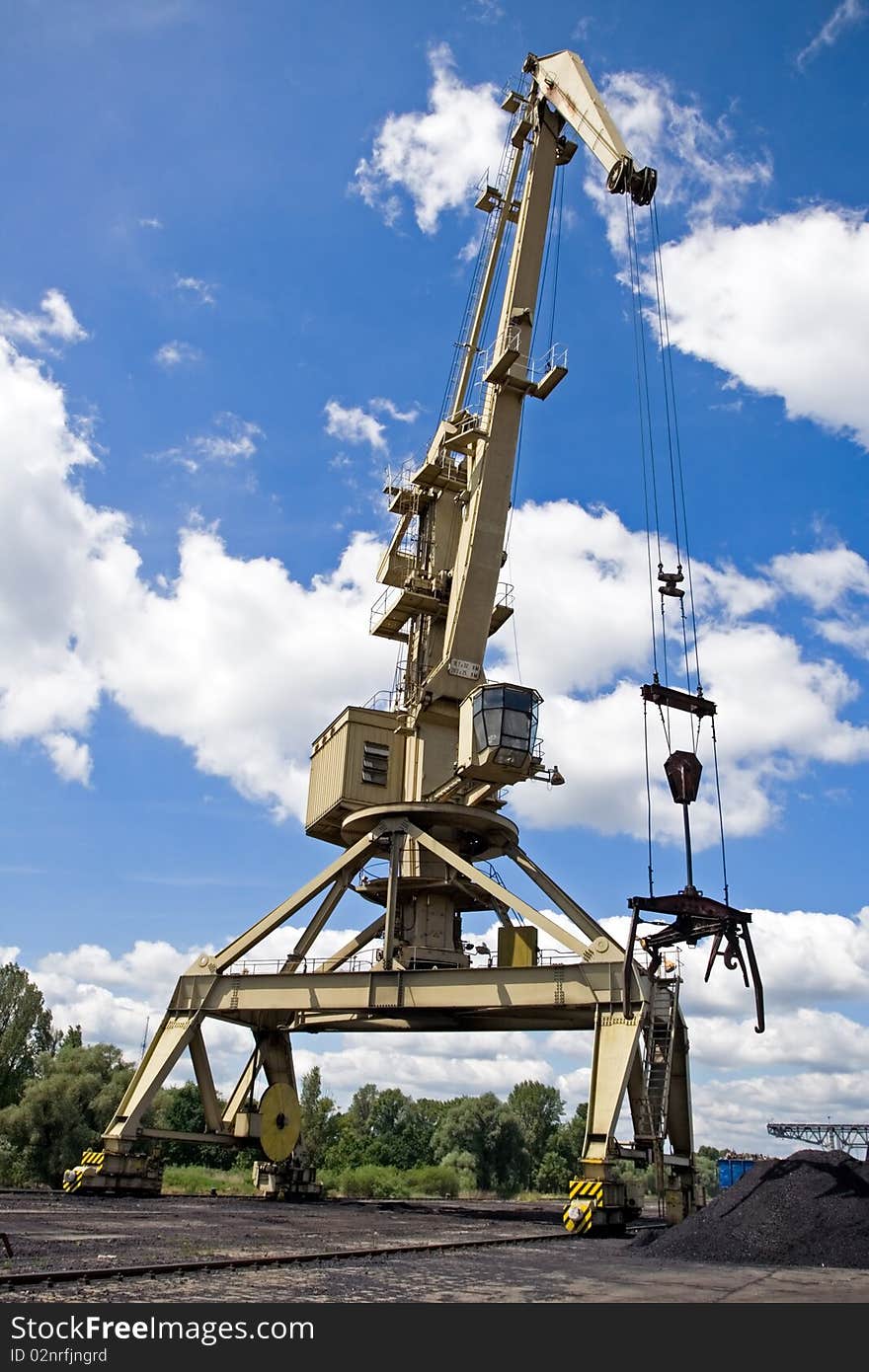 Crane At A Dock With Blue Sky