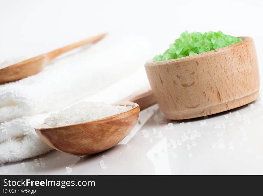 Spa essentials (bath salt in a spoon and towel)