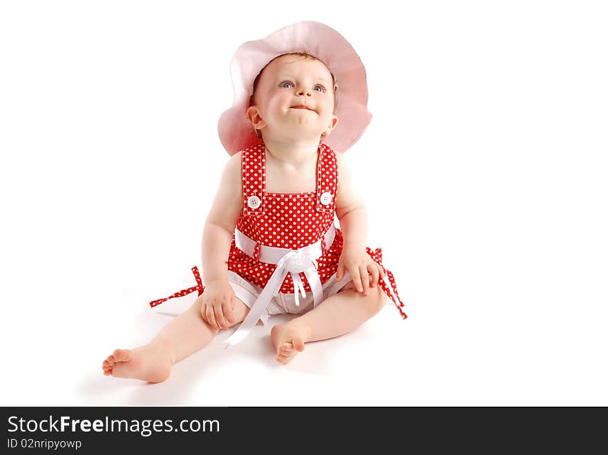 Little baby girl in red dress and hat