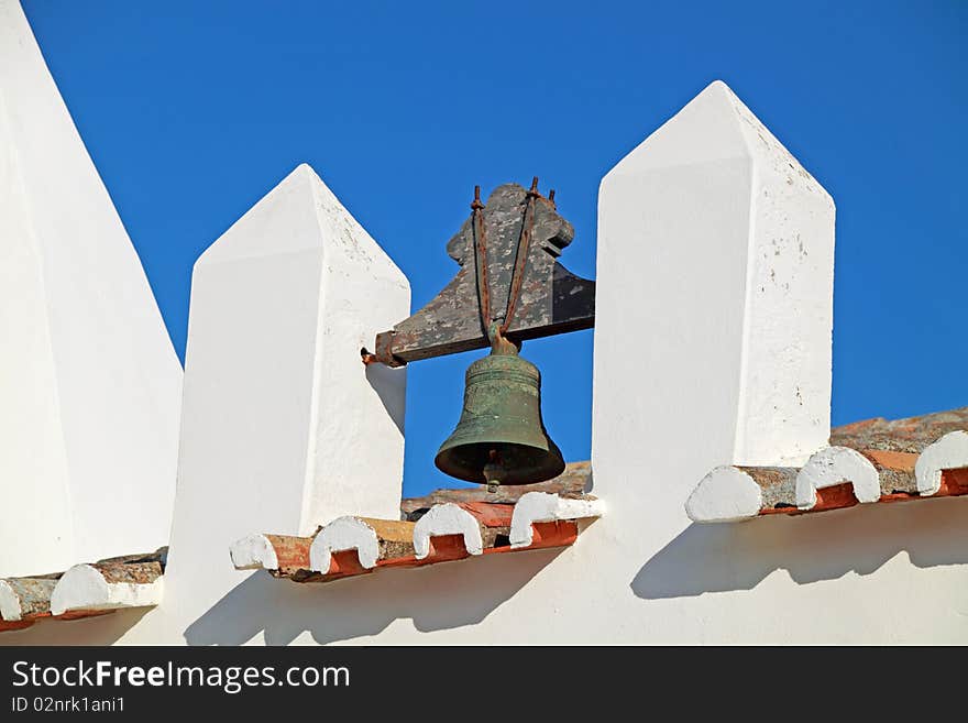 Closeup view of a bell of an old church in Algarve, Portugal