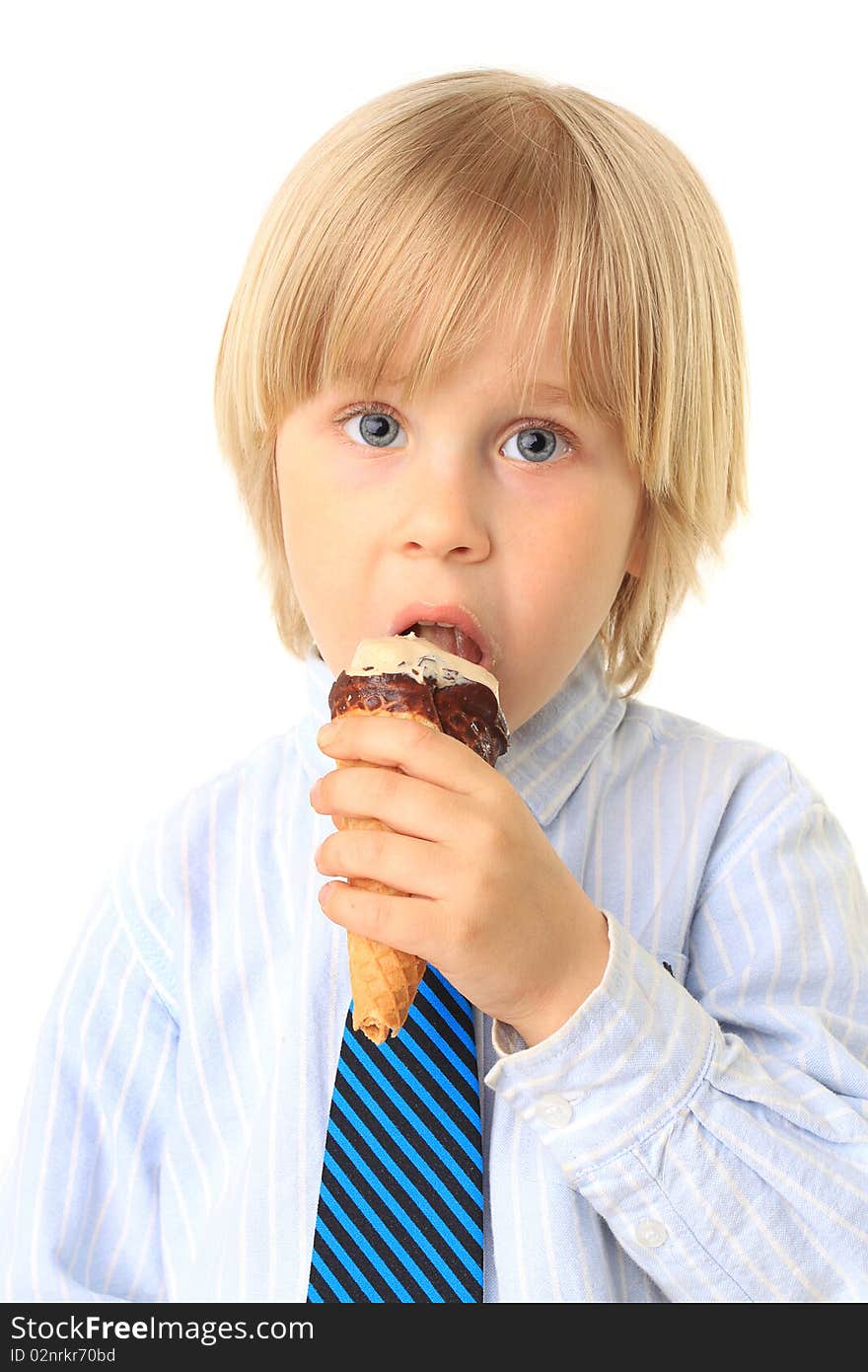 Little boy eating ice cream. Child isolated on white