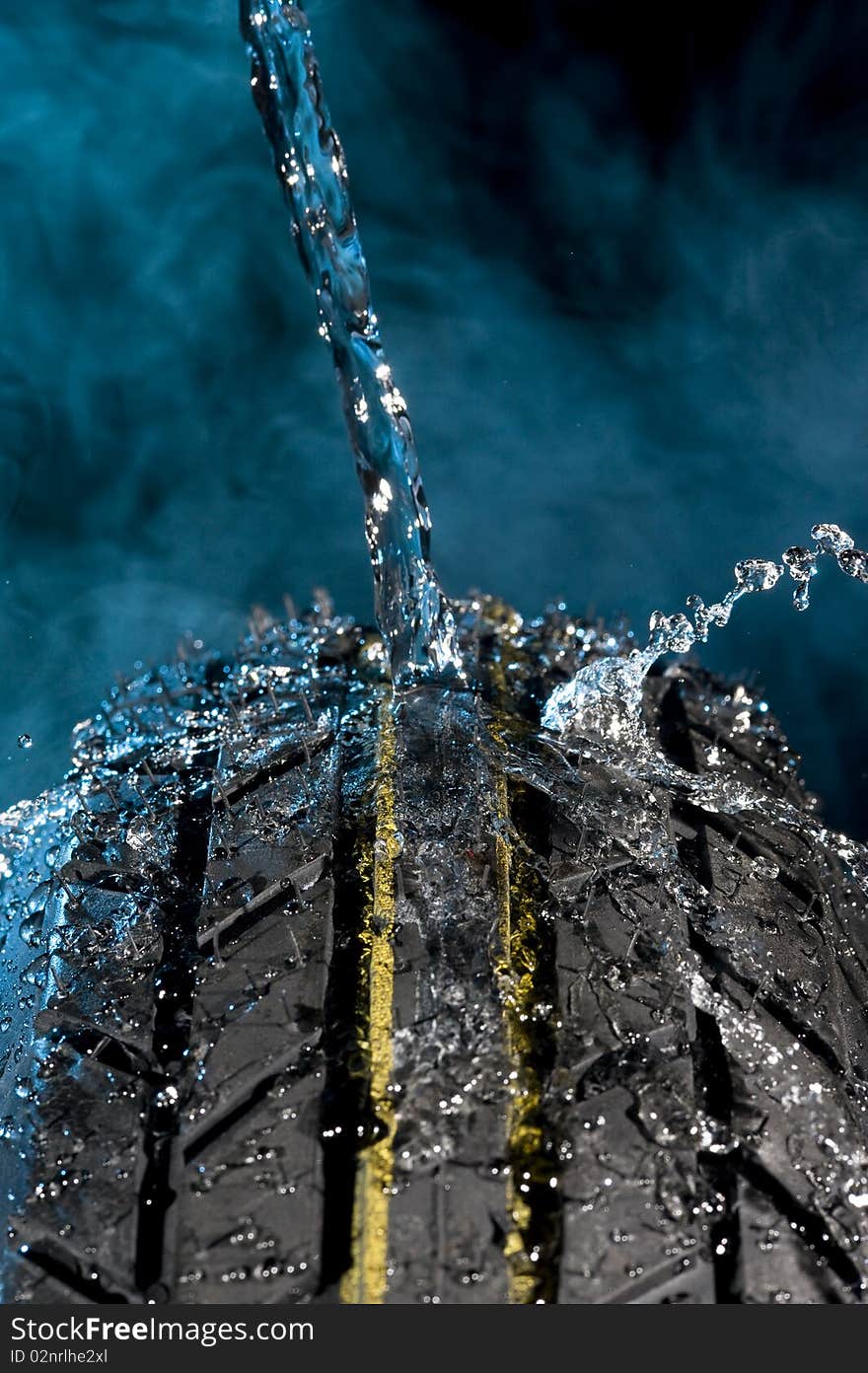 Tire with water drops on it smoke background