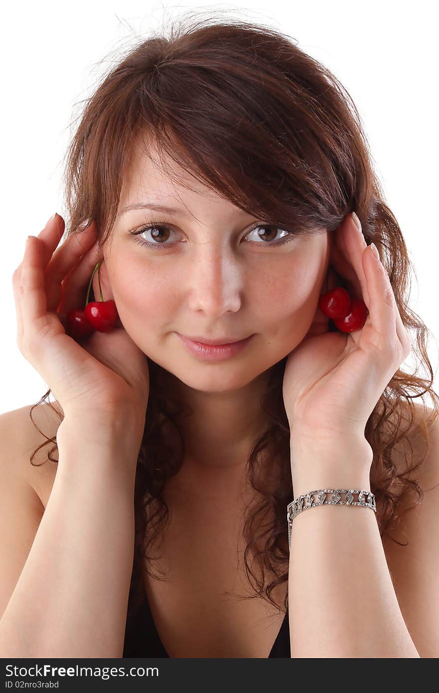 Closeup studio fashion portrait of a beautiful young sexy woman with jewelery bracelet and red cherry. Isolated on white background. Closeup studio fashion portrait of a beautiful young sexy woman with jewelery bracelet and red cherry. Isolated on white background