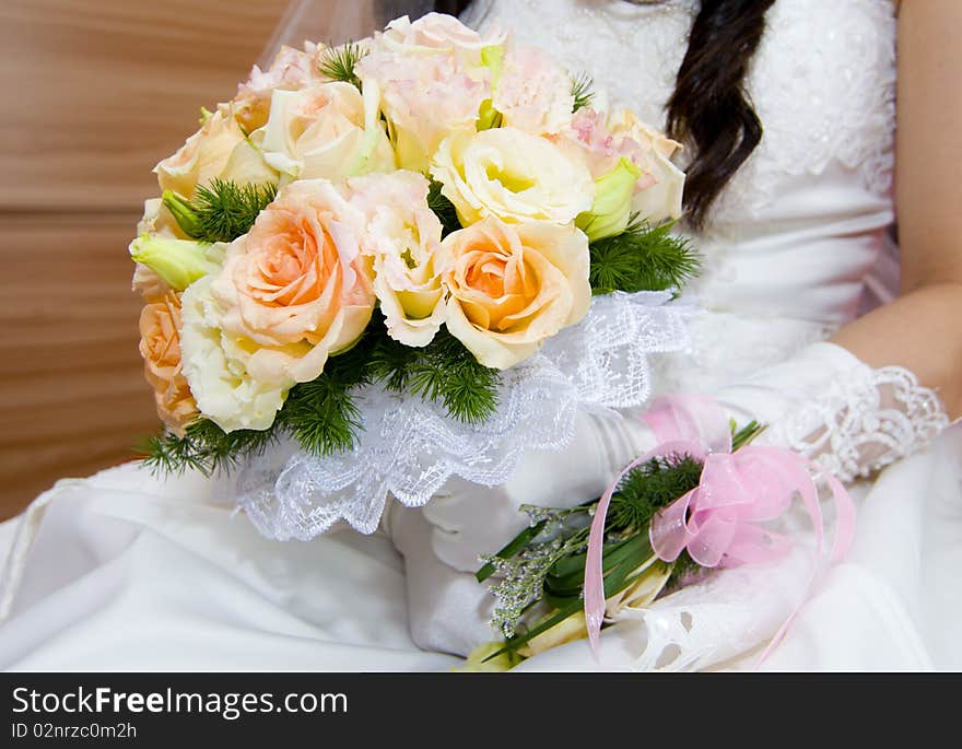 Lively wedding bride holding flowers