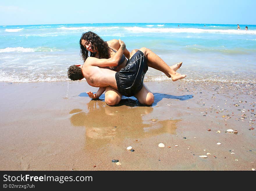 Teens having fun on the beach. Teens having fun on the beach.