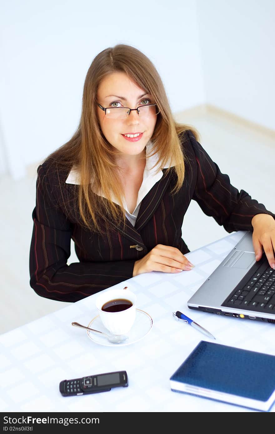 Business woman sitting at the workplace