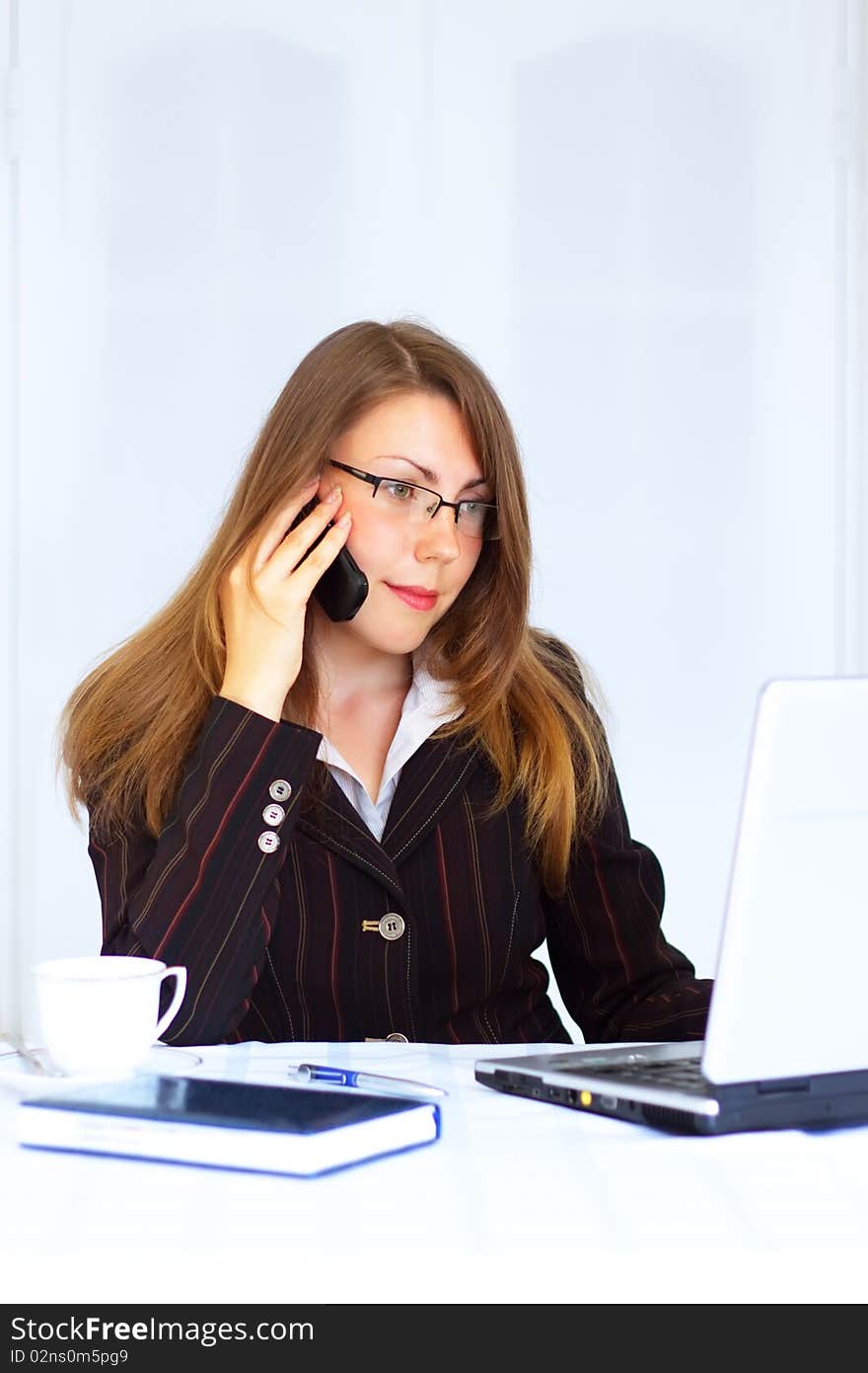 Business woman sitting at the workplace