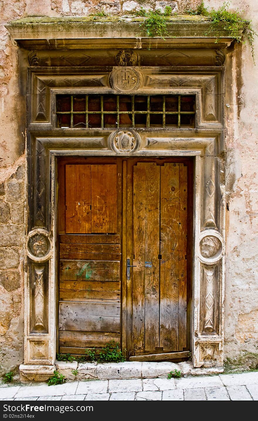 Old broken wooden door with religious symbols. Old broken wooden door with religious symbols