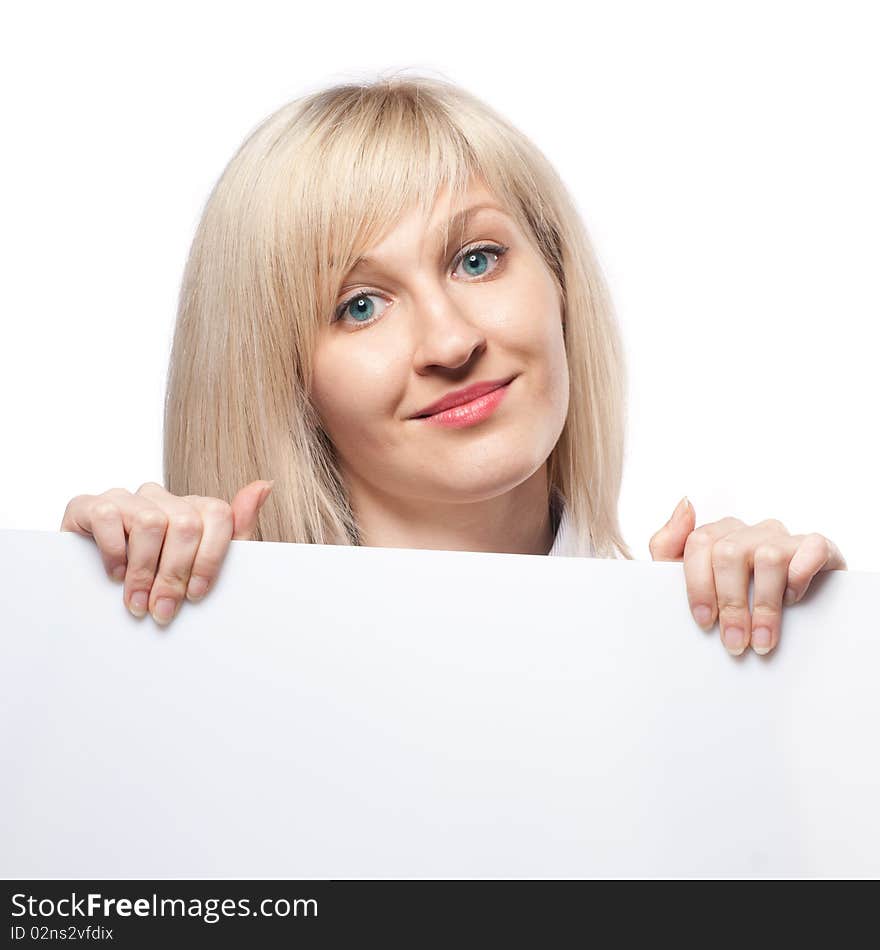 Beautiful smiling woman holding white empty paper