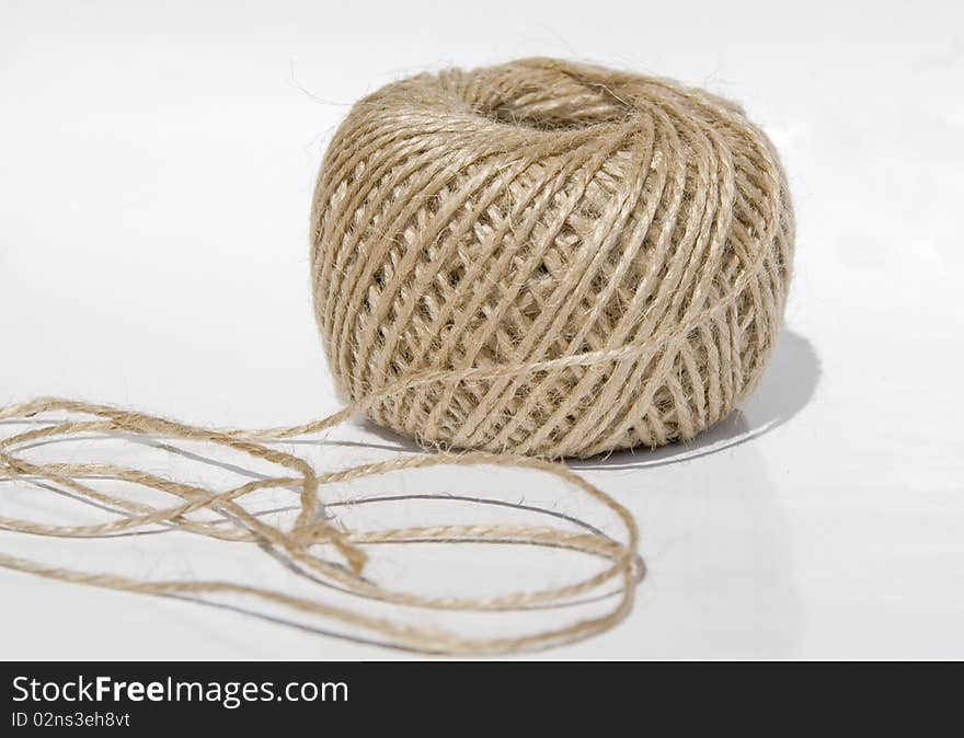 Ball of a twine on a white background isolated with reflection