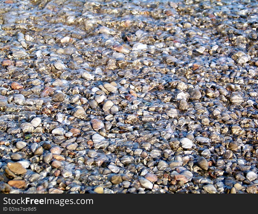 Pebble under storm water are very smooth. Pebble under storm water are very smooth