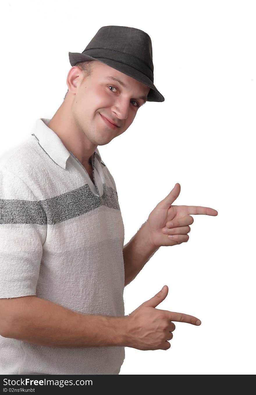 A smiling  young man showing of hands making shape like guns . A smiling  young man showing of hands making shape like guns .