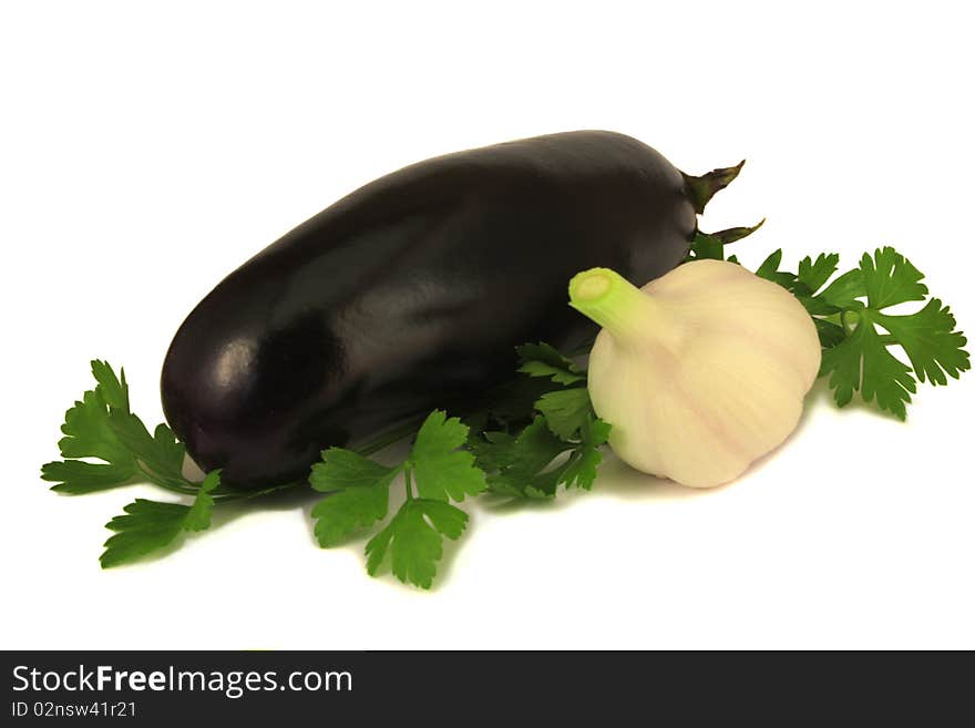 Eggplant, garlic and parsley on a white background