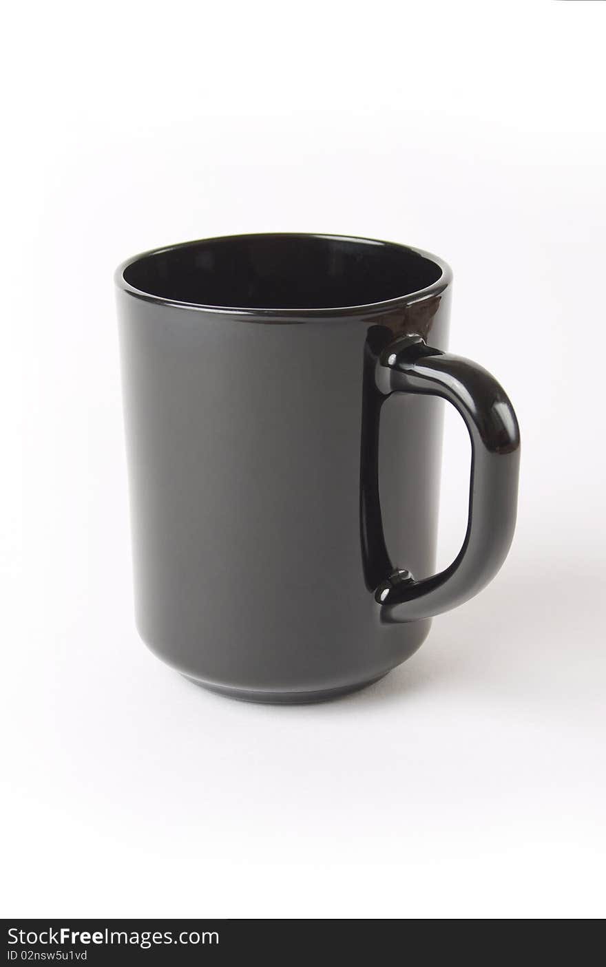 Black ceramic cup of coffee and tea over white background