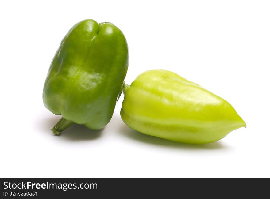 Two green pepper it is isolated on a white background. Two green pepper it is isolated on a white background.