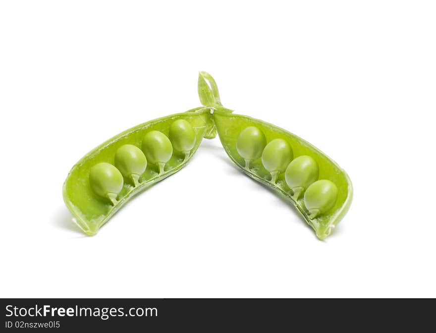 Open pod of peas it is isolated on a white background. Open pod of peas it is isolated on a white background.