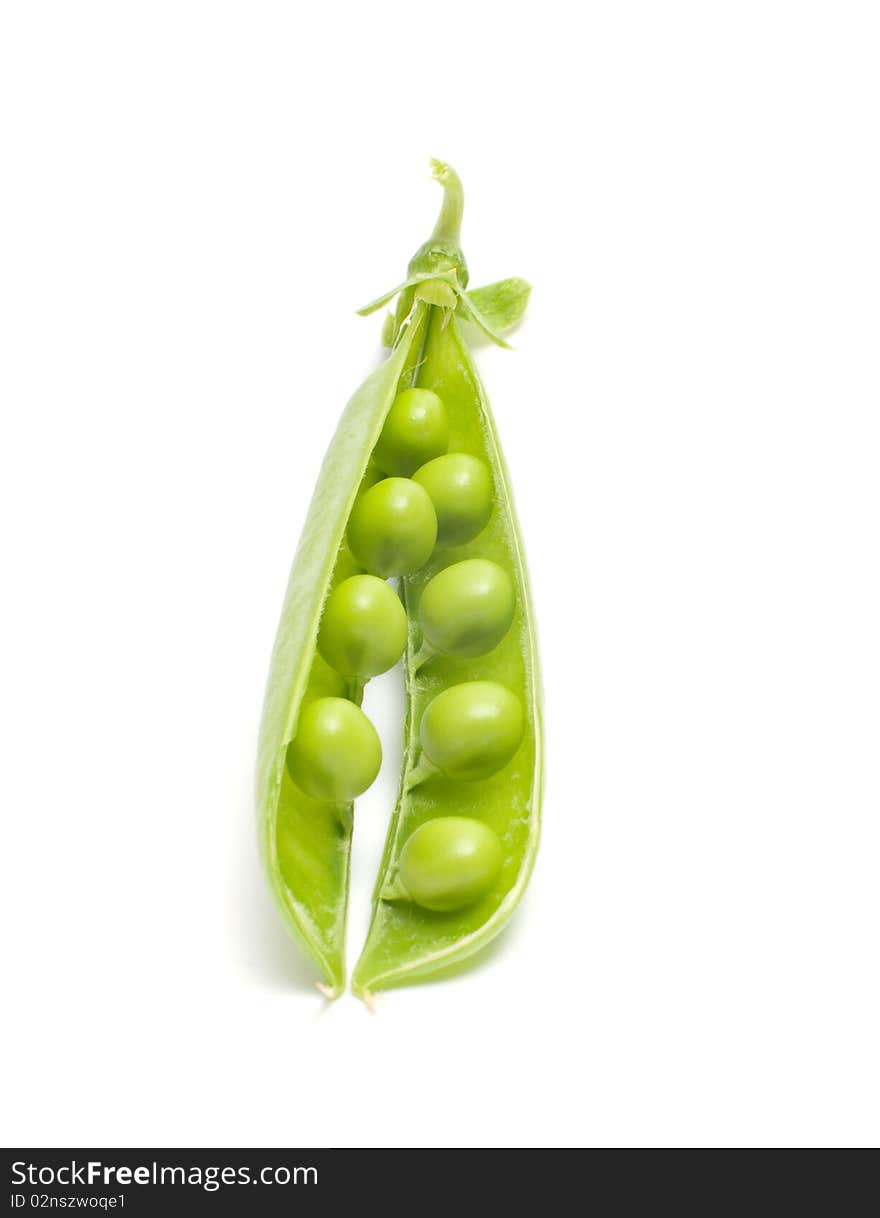 Open pod of peas it is isolated on a white background. Open pod of peas it is isolated on a white background.