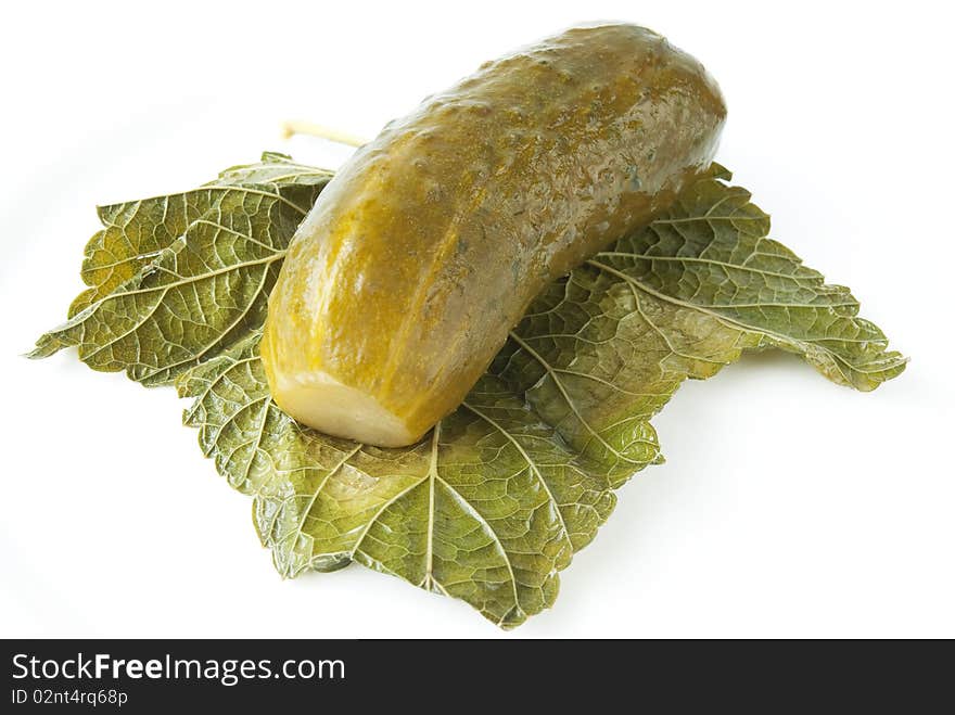 Juicy pickled cucumber with leaf isolated