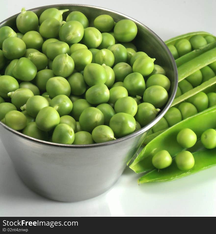 Basket of peas in spring