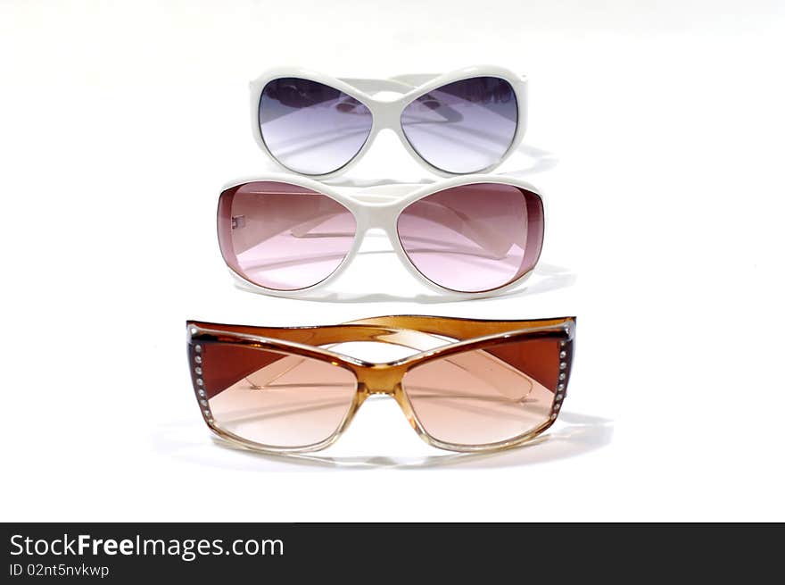 Row of fashion sunglasses on white. Row of fashion sunglasses on white