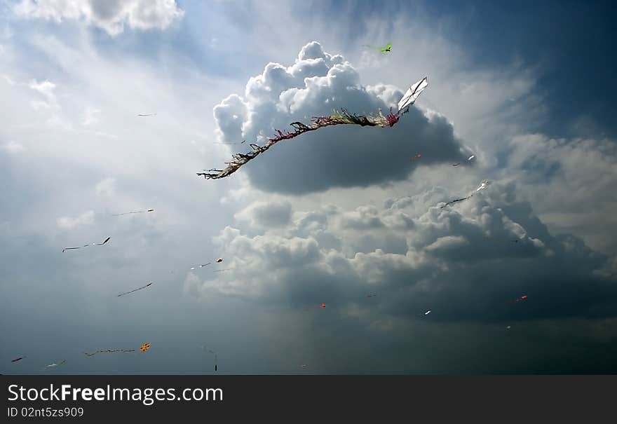 Color kites in cloud sky