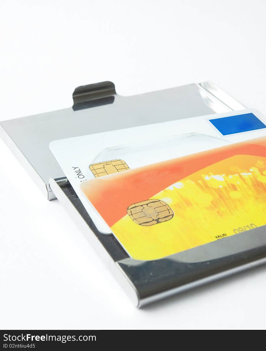 Credit card with metallic case over white