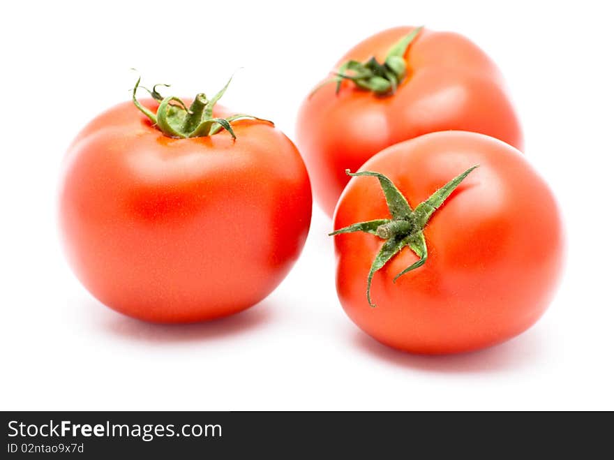 Fresh tomatoes isolated on a white background.