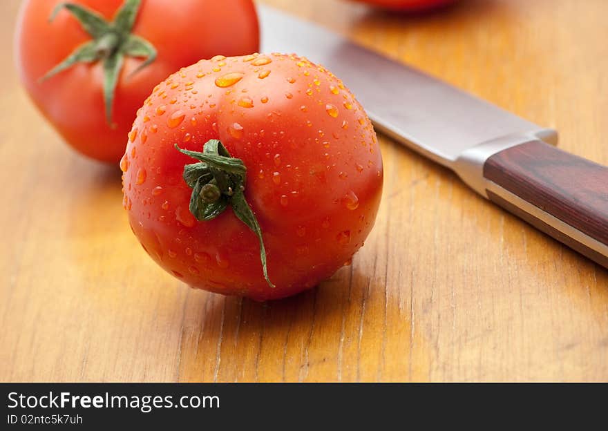 Fresh tomatoes on a wood background