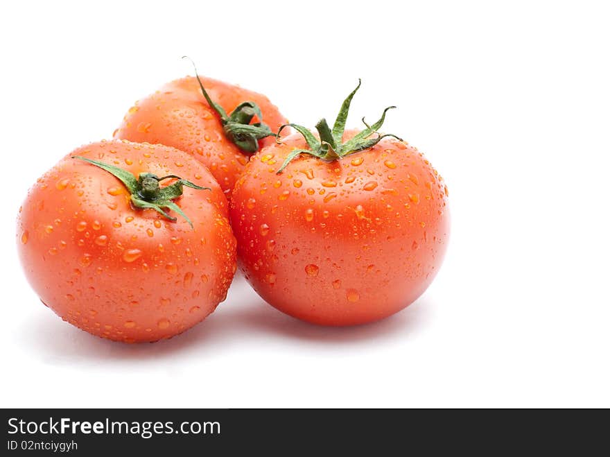 Fresh tomatoes  isolated on a white background.