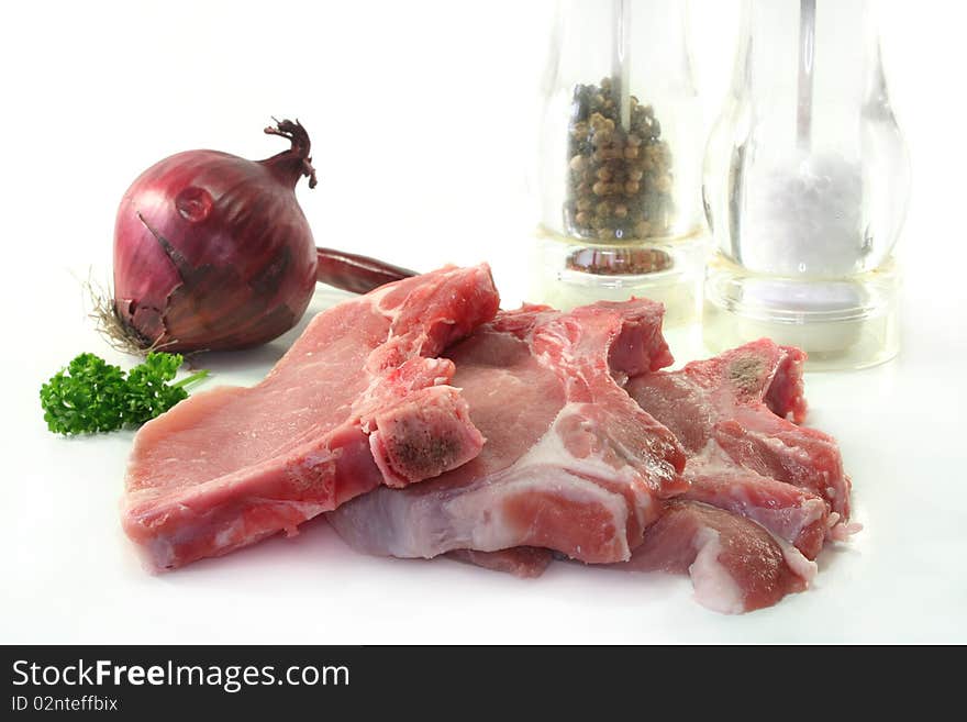 Raw chops on a white background