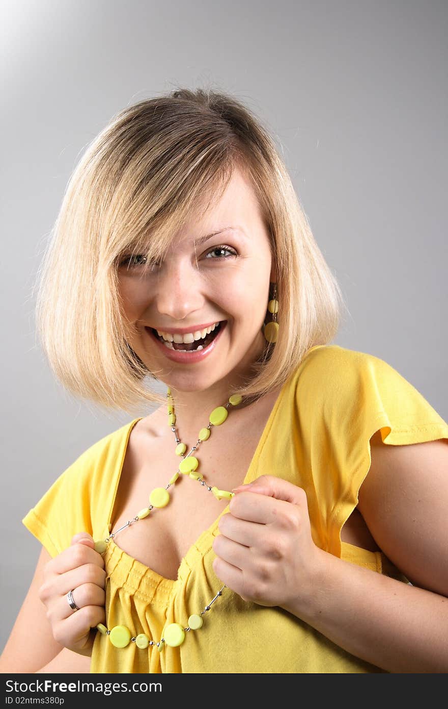 Smiling girl in yellow shirt